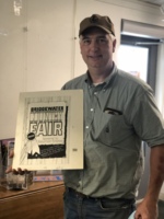 Colin Brown with a print of the original Bridgewater Fair artwork